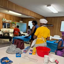 Members sharing fellowship around a table